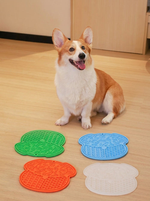 Hauloft lick mat in four colors with a corgi