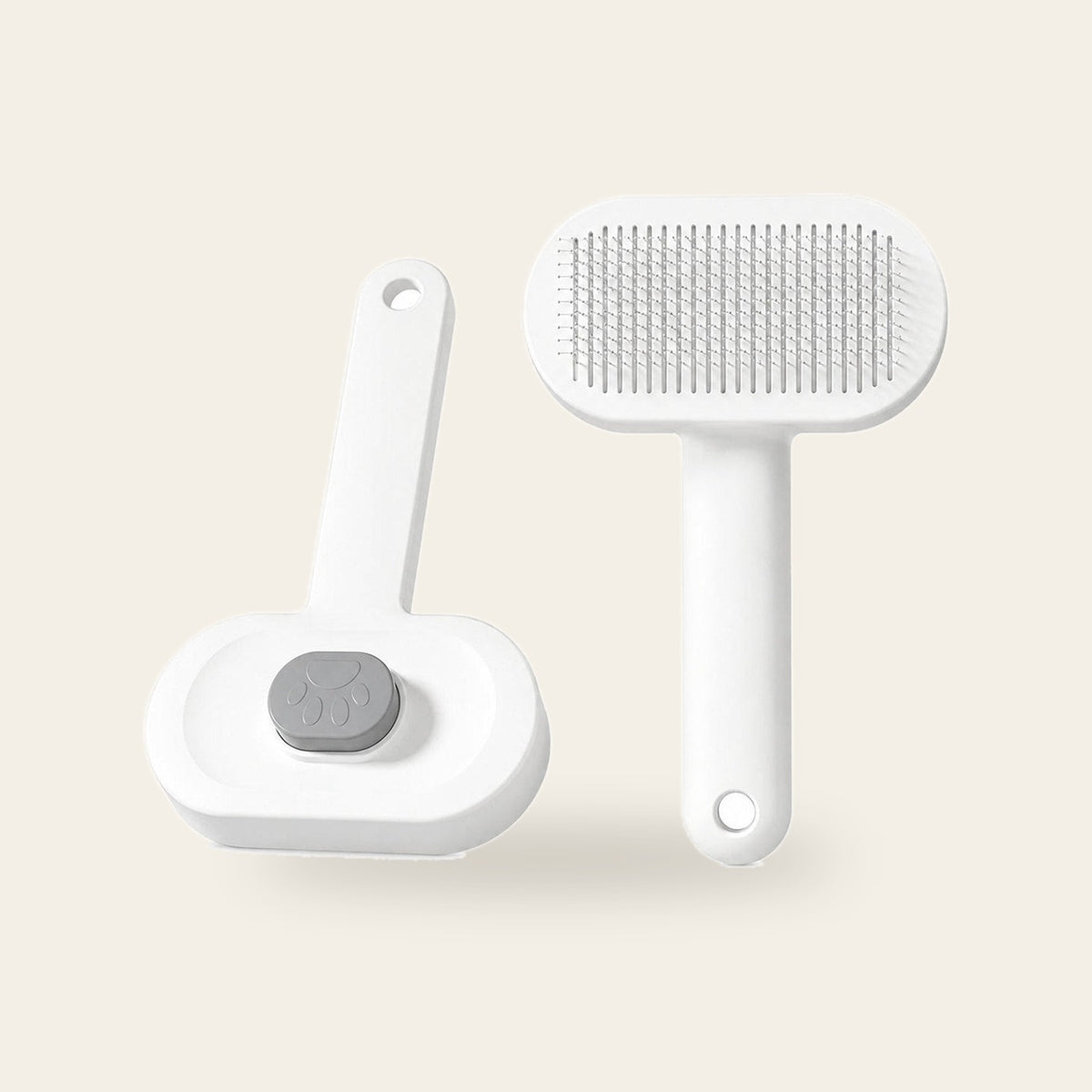 White self-cleaning slicker brush, front and side views, on a plain sand background