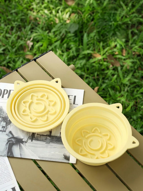Hauloft collapsible travel dog bowl, two bowls on a picnic table