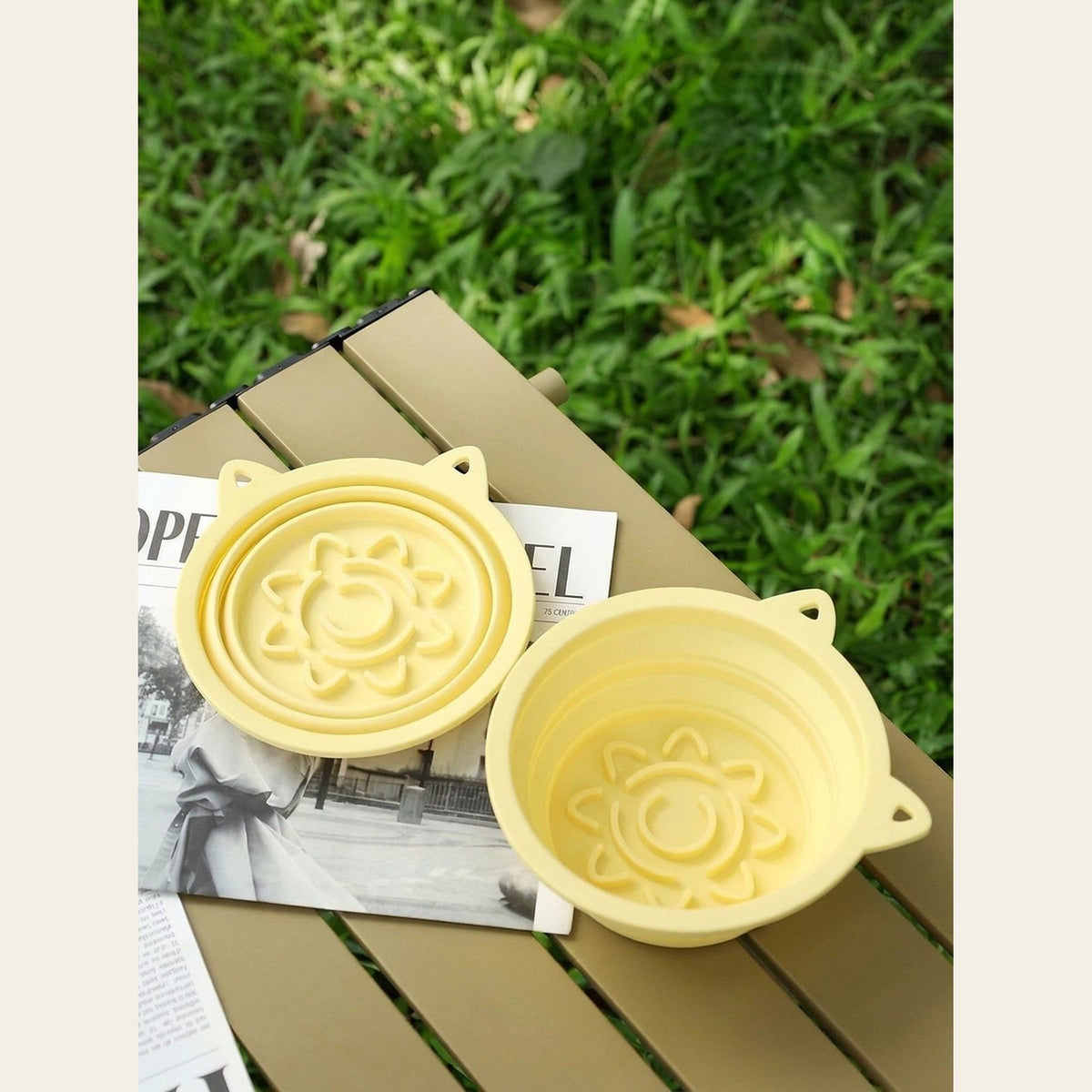 Hauloft collapsible travel dog bowl, two bowls on a picnic table